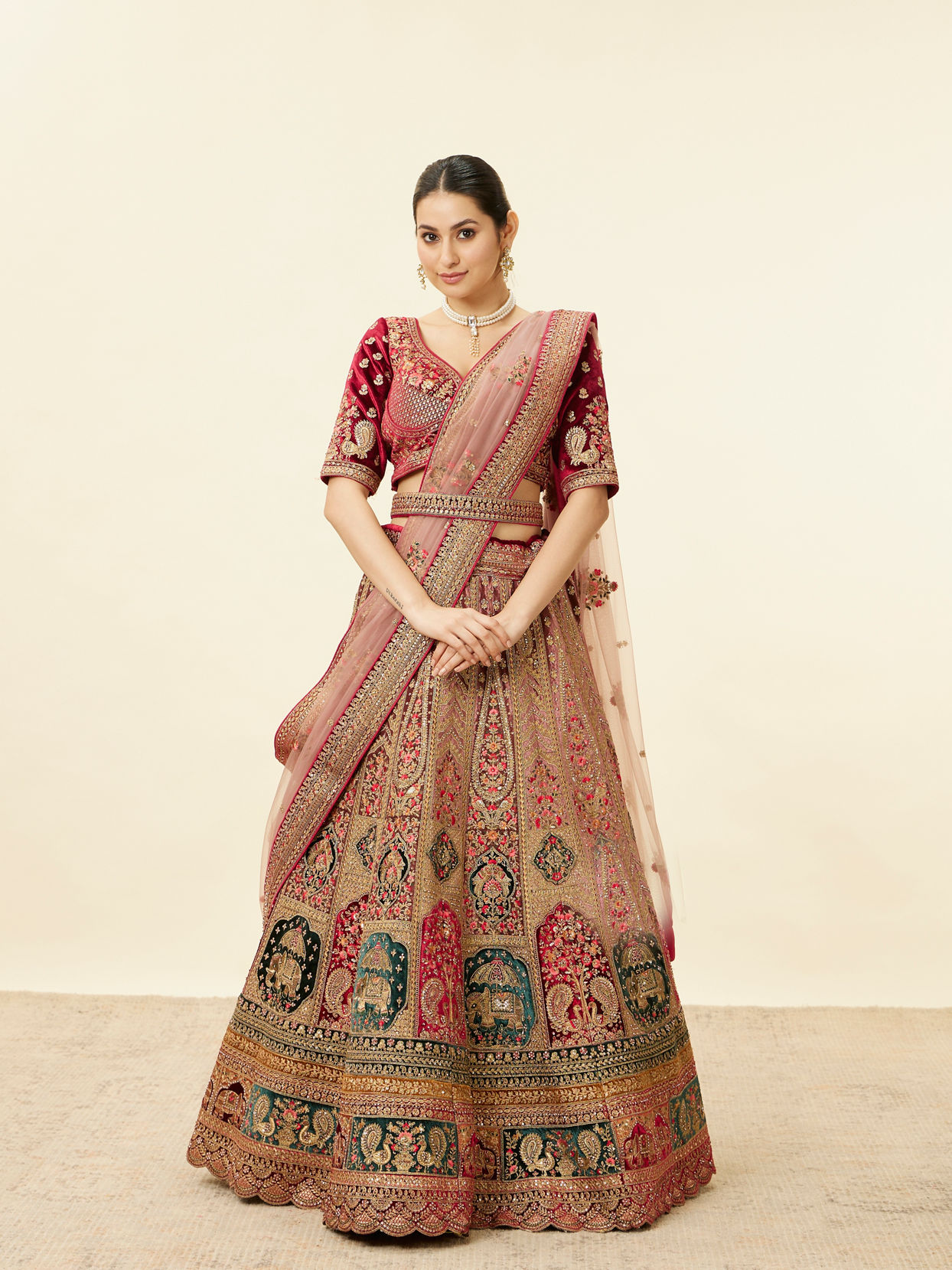 alt message - Mohey Women Rich Red Aari Embroidered Bridal Lehenga image number 1