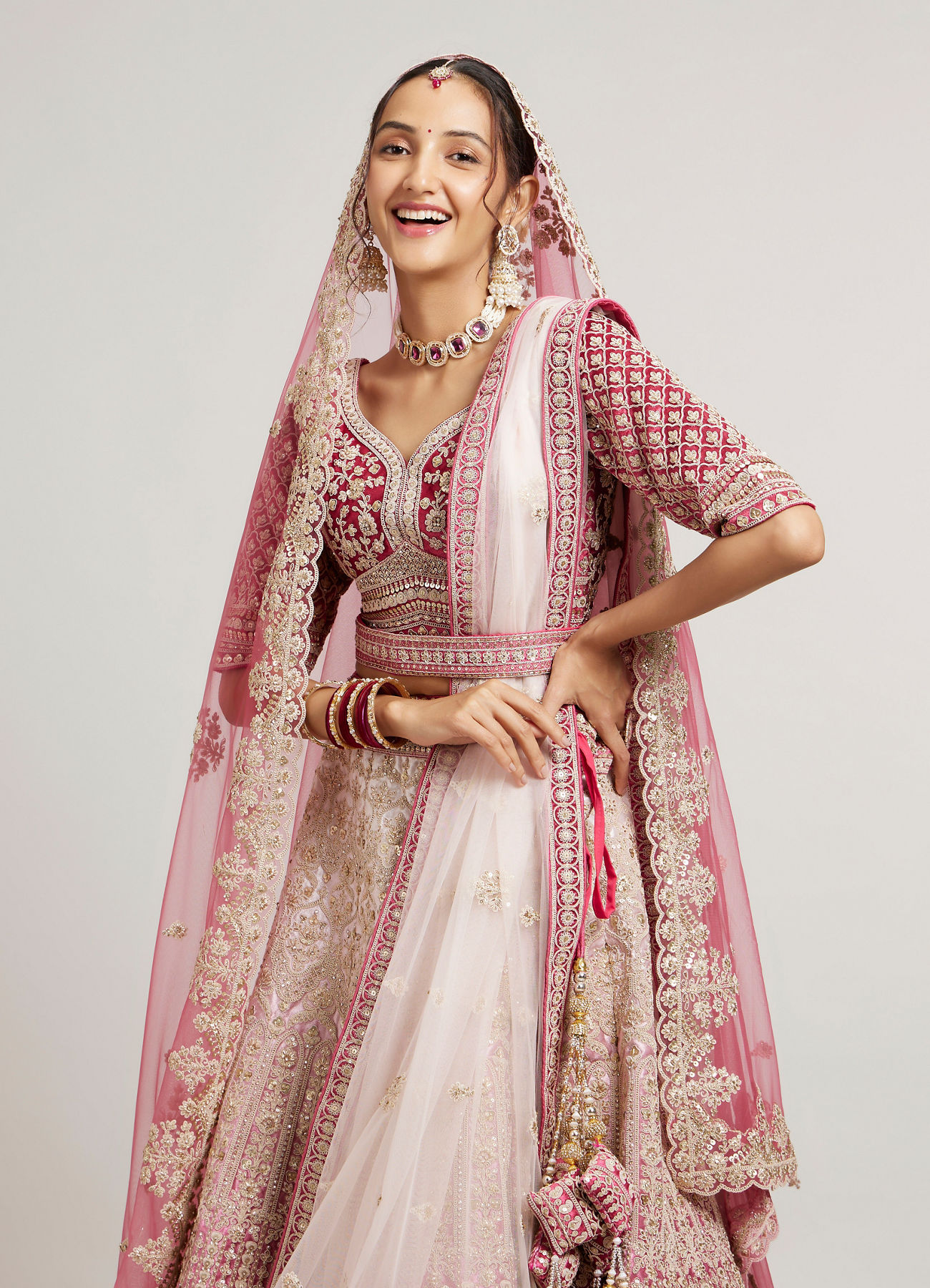 Mohey Women Coral and Light Pink Aari Embroidered Lehenga with Mirror Work