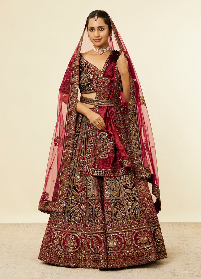 alt message - Mohey Women Maroon Paisley Floral Embroidered Bridal Lehenga image number 0