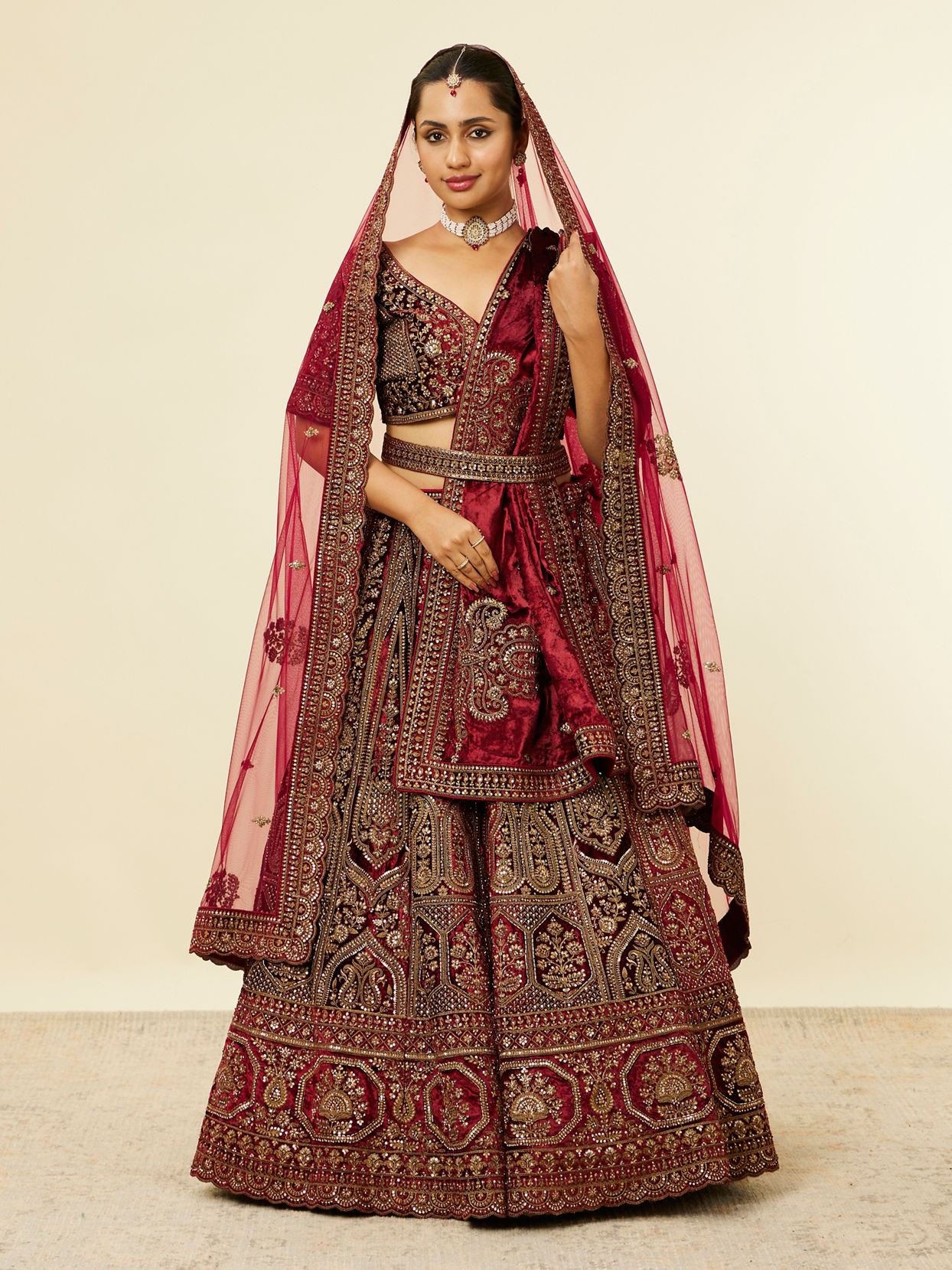 alt message - Mohey Women Maroon Paisley Floral Embroidered Bridal Lehenga image number 0