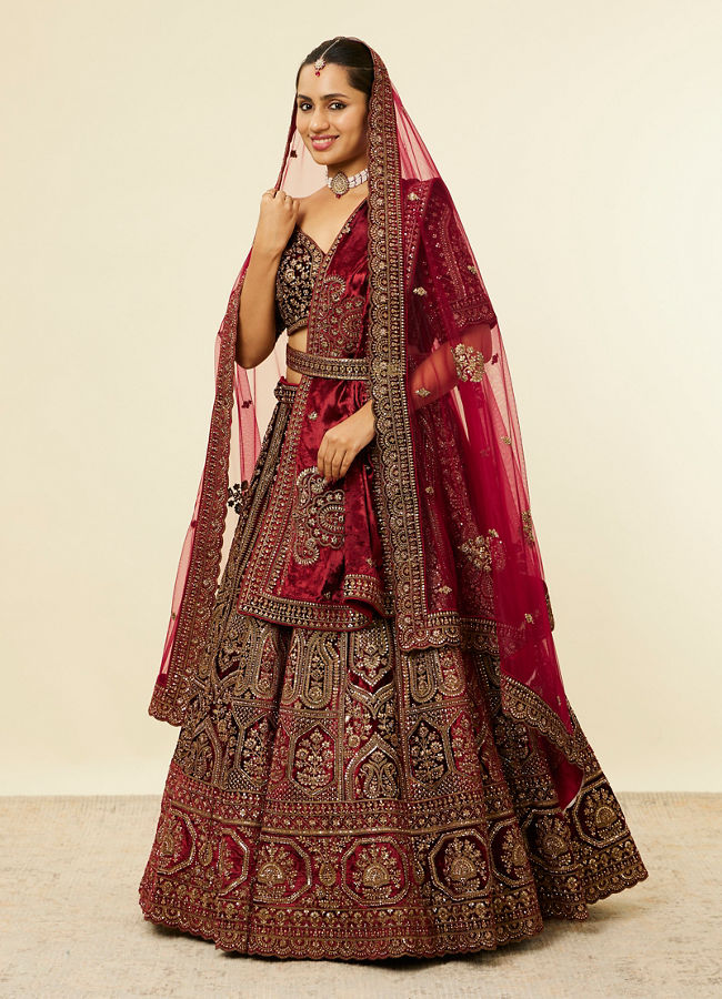 alt message - Mohey Women Maroon Paisley Floral Embroidered Bridal Lehenga image number 2