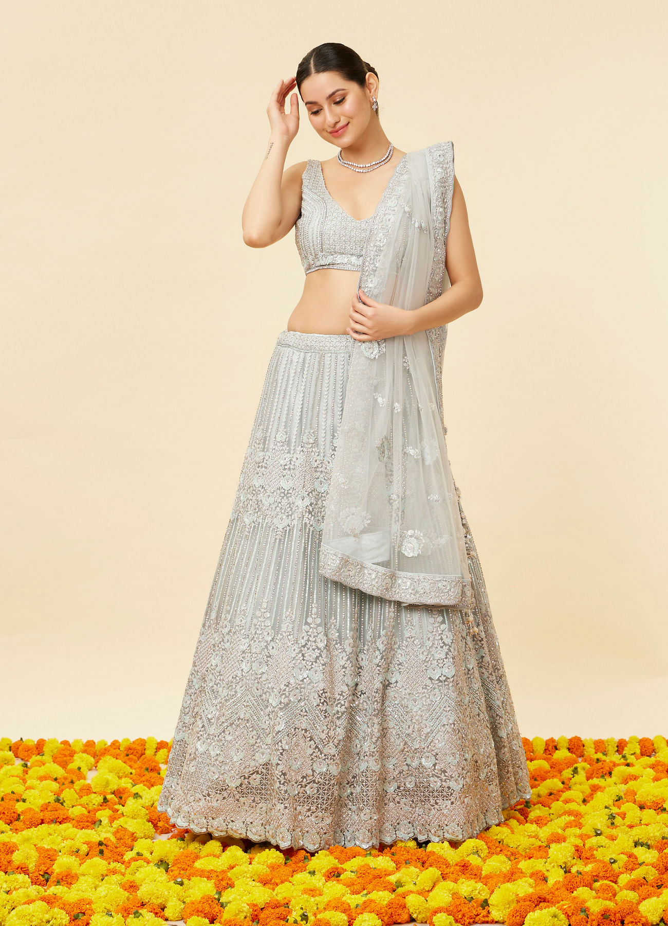 Mohey Women Powder Blue Rhinestone and Sitara Embroidered Bridal Lehenga