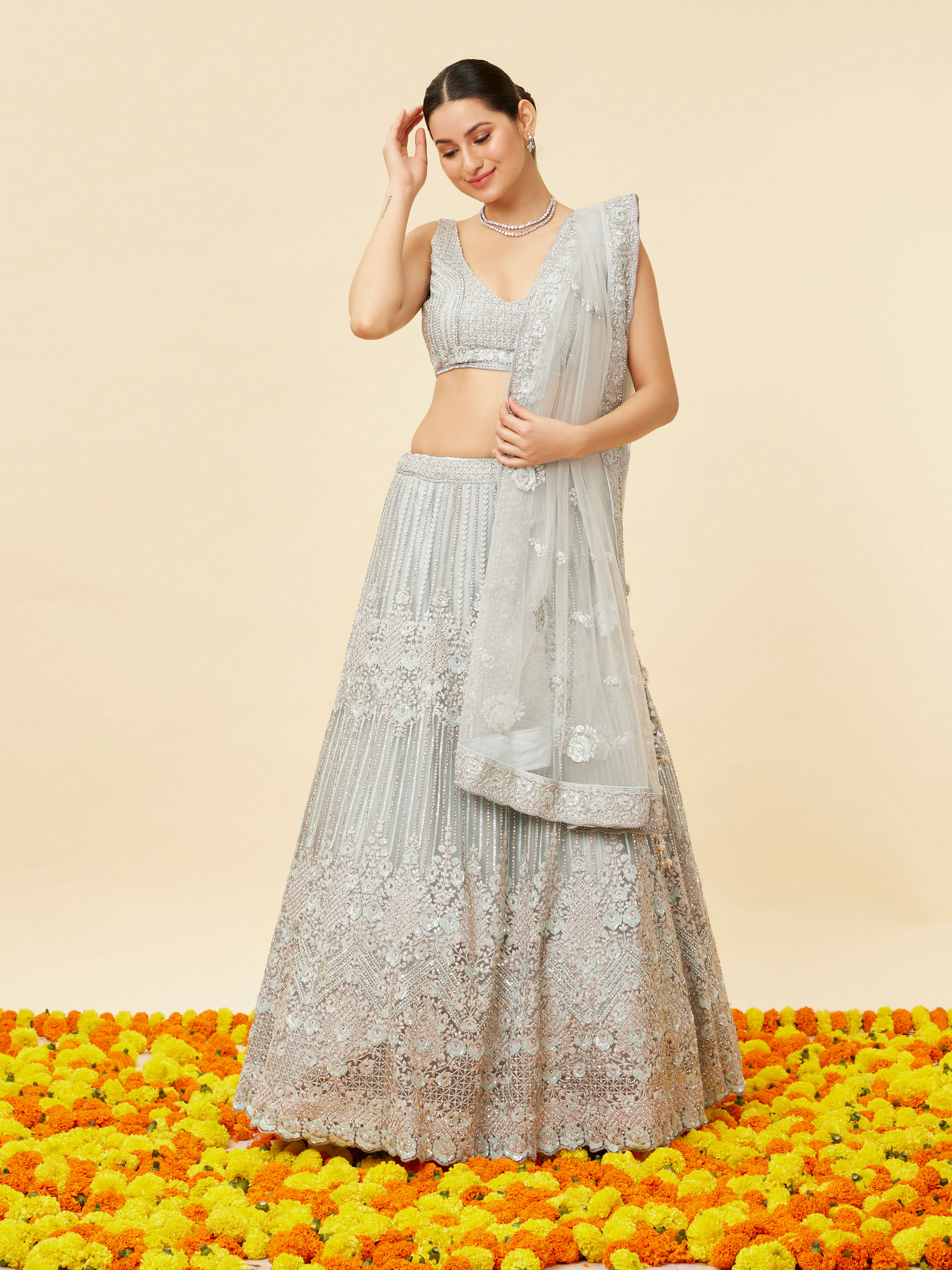 Mohey Women Powder Blue Rhinestone and Sitara Embroidered Bridal Lehenga