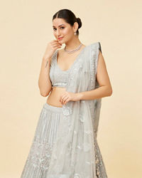 Mohey Women Powder Blue Rhinestone and Sitara Embroidered Bridal Lehenga
