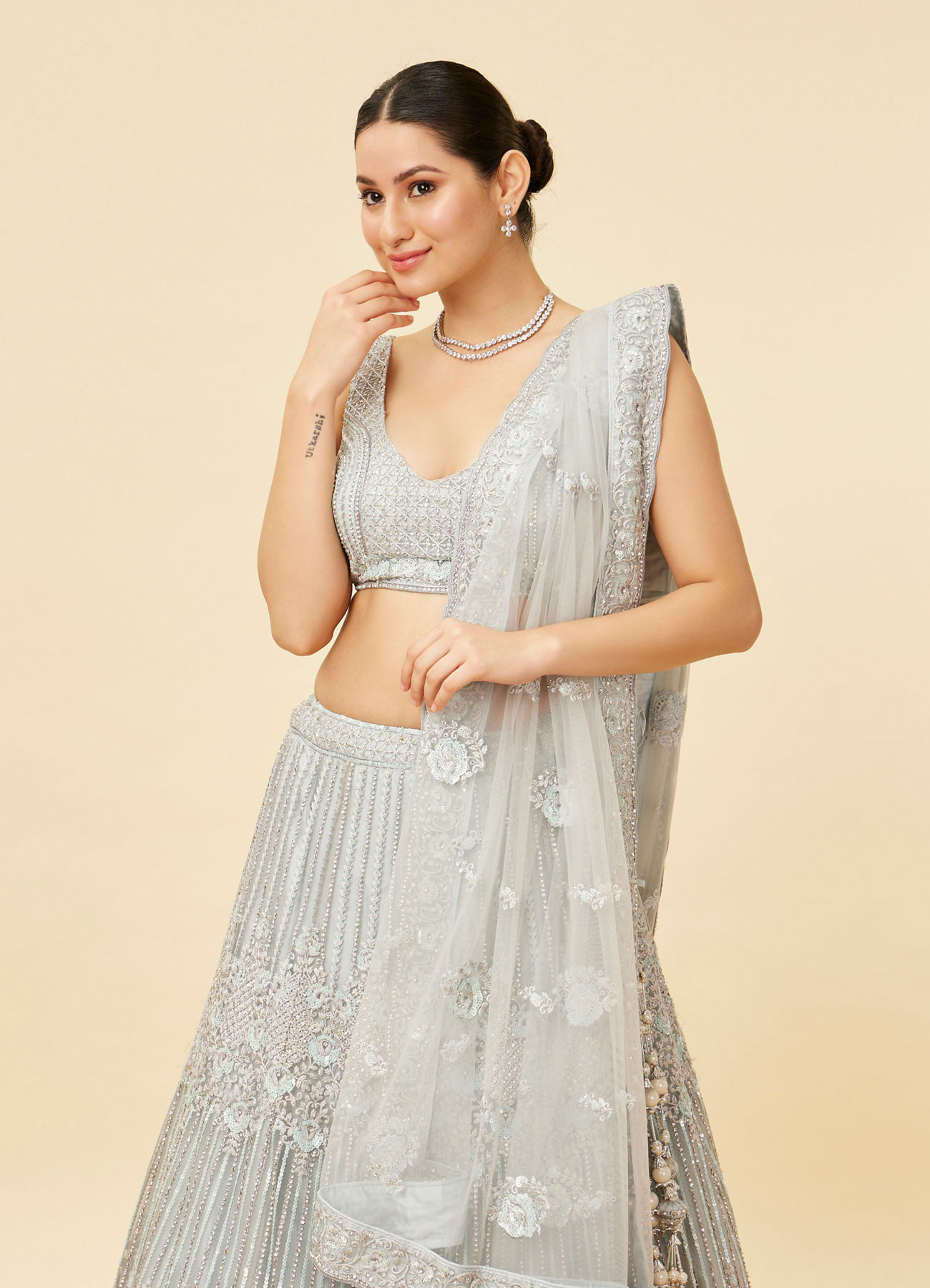 Mohey Women Powder Blue Rhinestone and Sitara Embroidered Bridal Lehenga