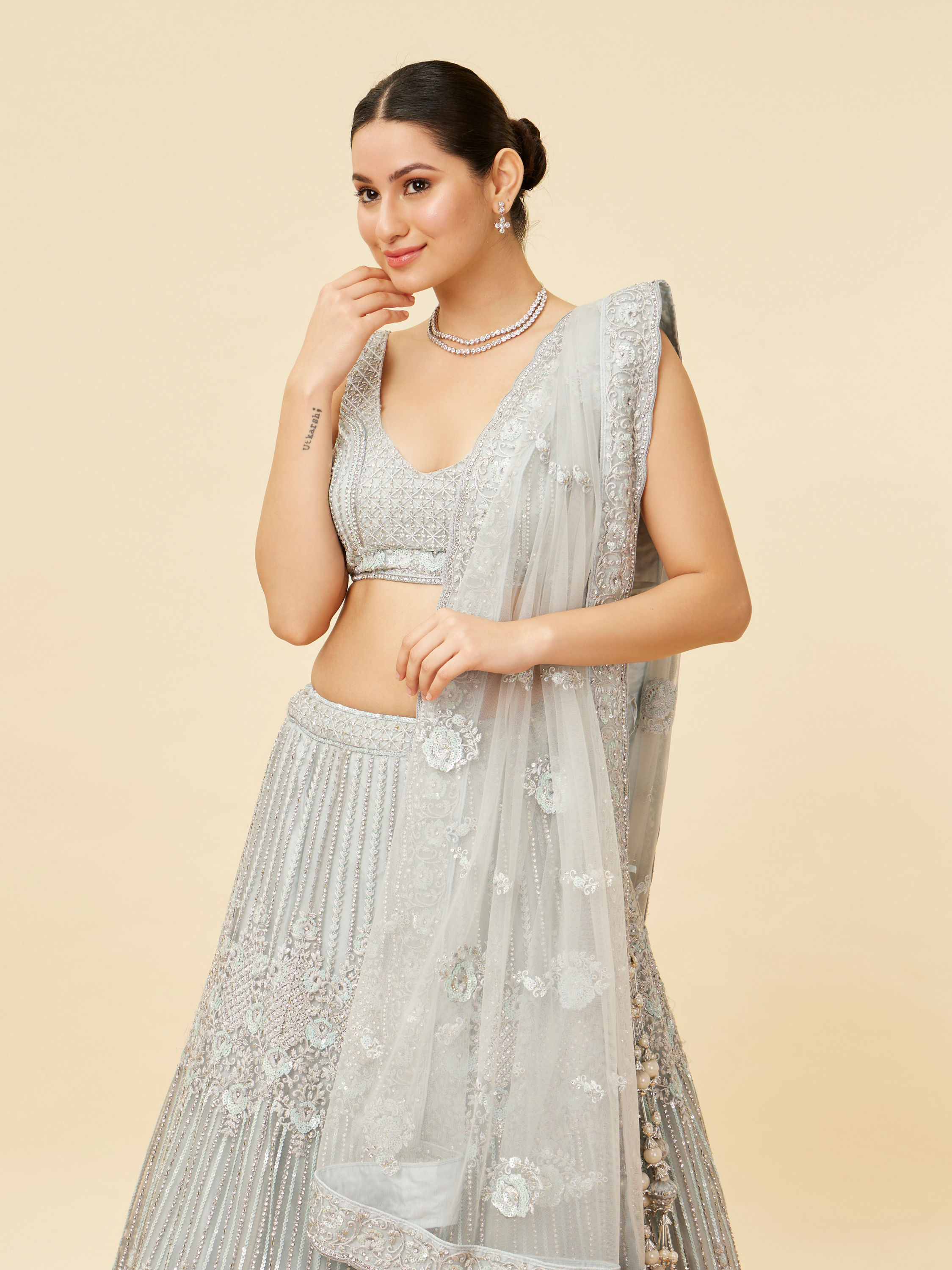 Mohey Women Powder Blue Rhinestone and Sitara Embroidered Bridal Lehenga