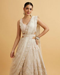 Mohey Women Dark Cream Floral Paisley Embroidered Bridal Lehenga with Round Trimmed Latkans