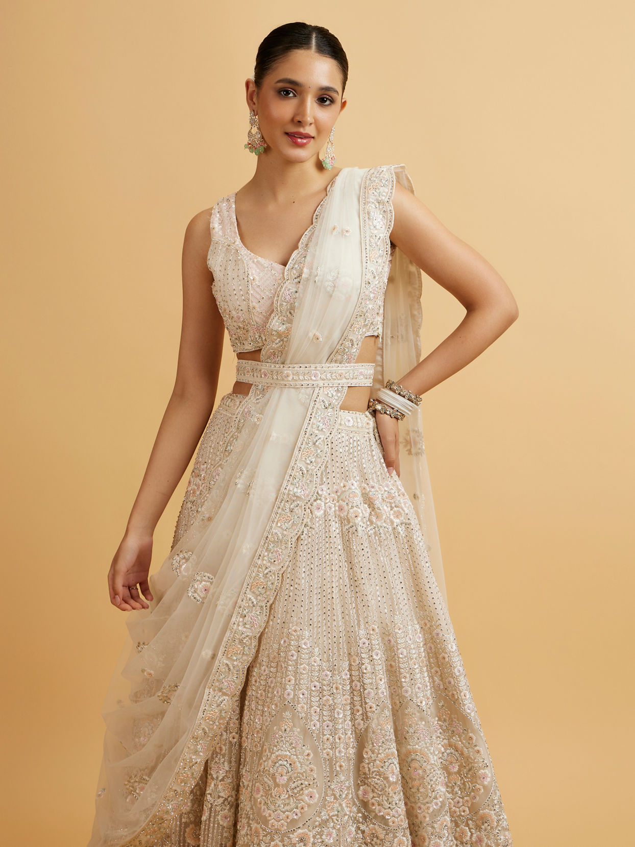 Mohey Women Dark Cream Floral Paisley Embroidered Bridal Lehenga with Round Trimmed Latkans