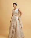 Mohey Women Dark Cream Floral Paisley Embroidered Bridal Lehenga with Round Trimmed Latkans