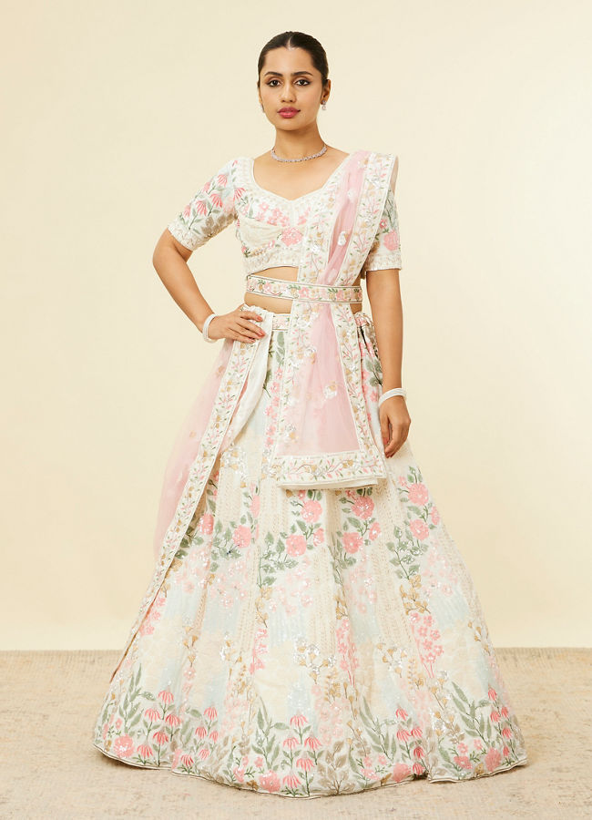 alt message - Mohey Women Cream Floral Sitara Embroidered Lehenga with Round Trimmed Latkans image number 0