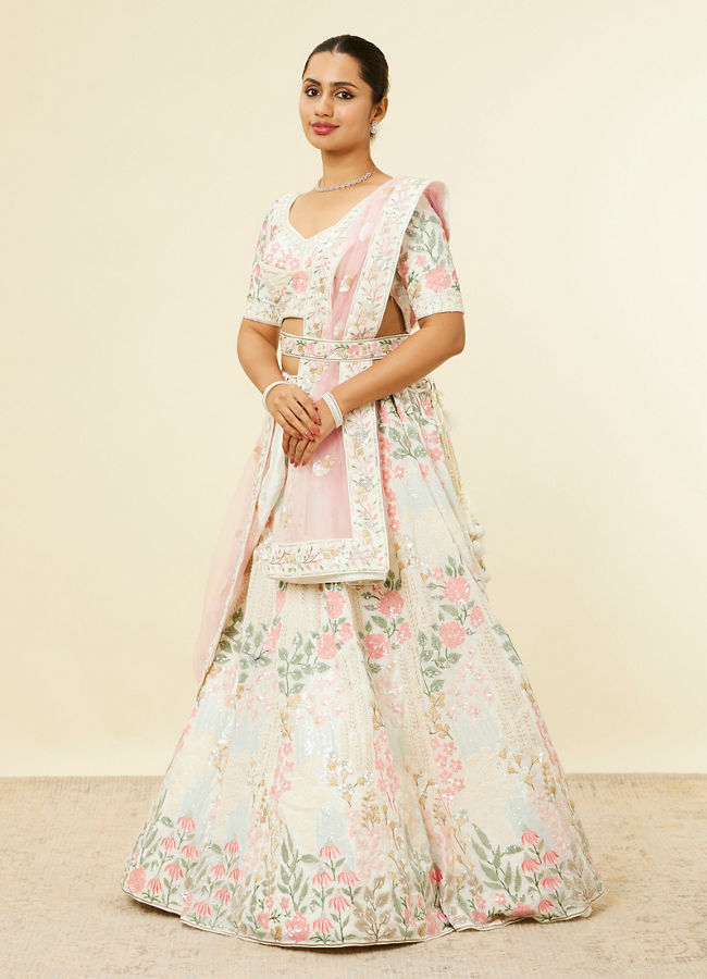 alt message - Mohey Women Cream Floral Sitara Embroidered Lehenga with Round Trimmed Latkans image number 2