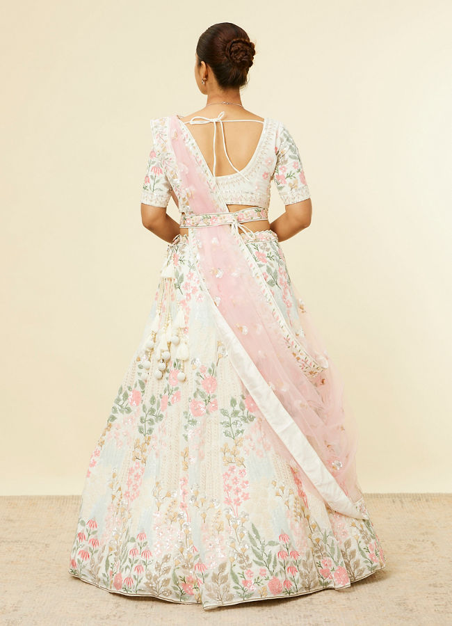 alt message - Mohey Women Cream Floral Sitara Embroidered Lehenga with Round Trimmed Latkans image number 4