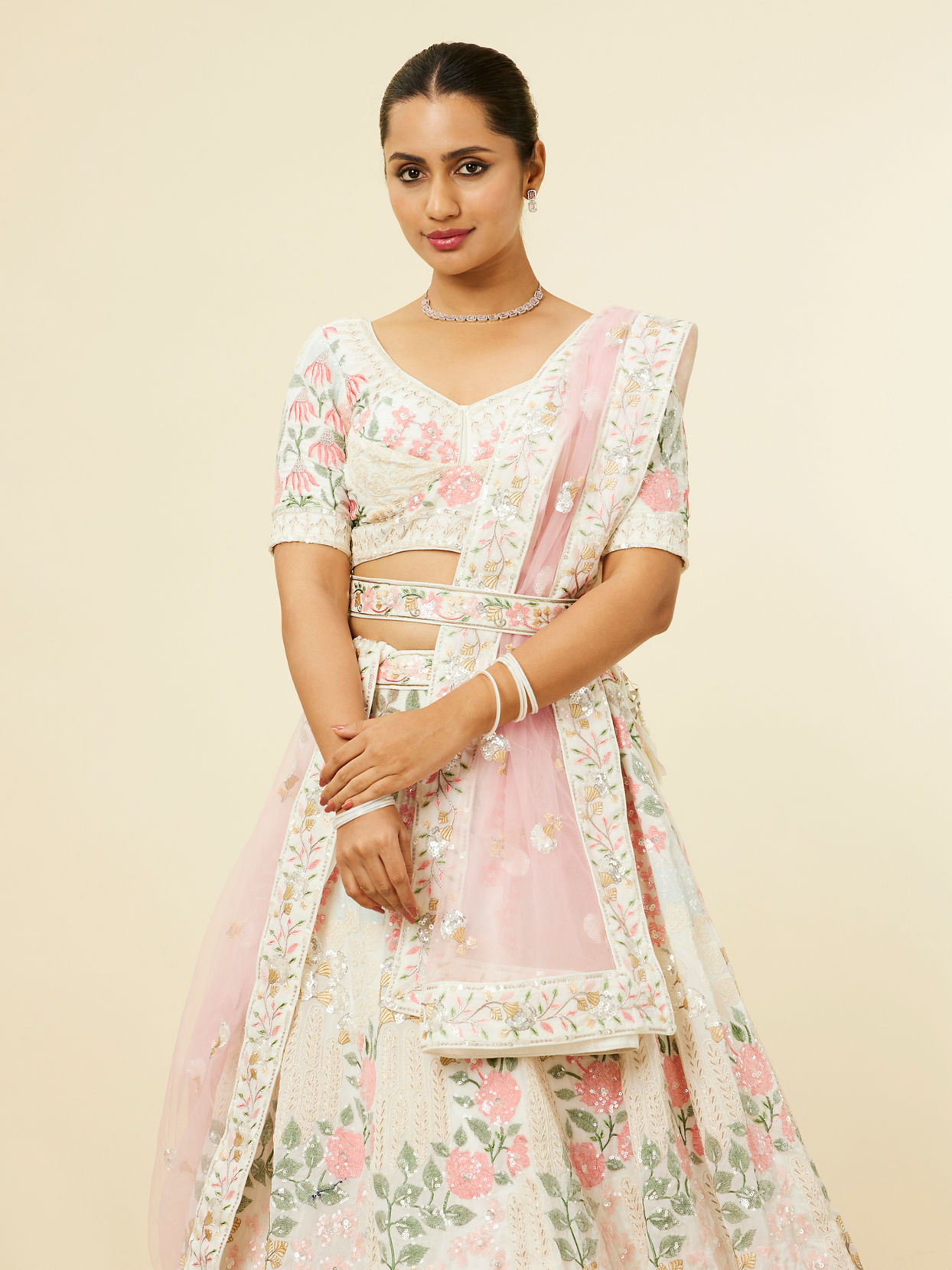 alt message - Mohey Women Cream Floral Sitara Embroidered Lehenga with Round Trimmed Latkans image number 1