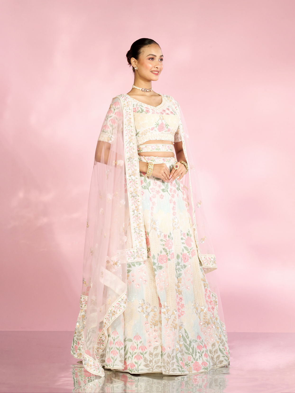 Mohey Women Cream Floral Sitara Embroidered Lehenga with Round Trimmed Latkans