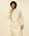 alt message - Manyavar Men Soft Beige Self Patterned Nehru Jacket image number 0