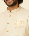 alt message - Manyavar Men Soft Beige Self Patterned Nehru Jacket image number 1